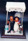 Jewish Wedding Cake Topper, Hockey playing Groom and Photographer Bride under a Rhubba