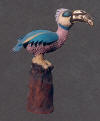 ceramic bird sculpture, multicolored glazes, gold lustred beak