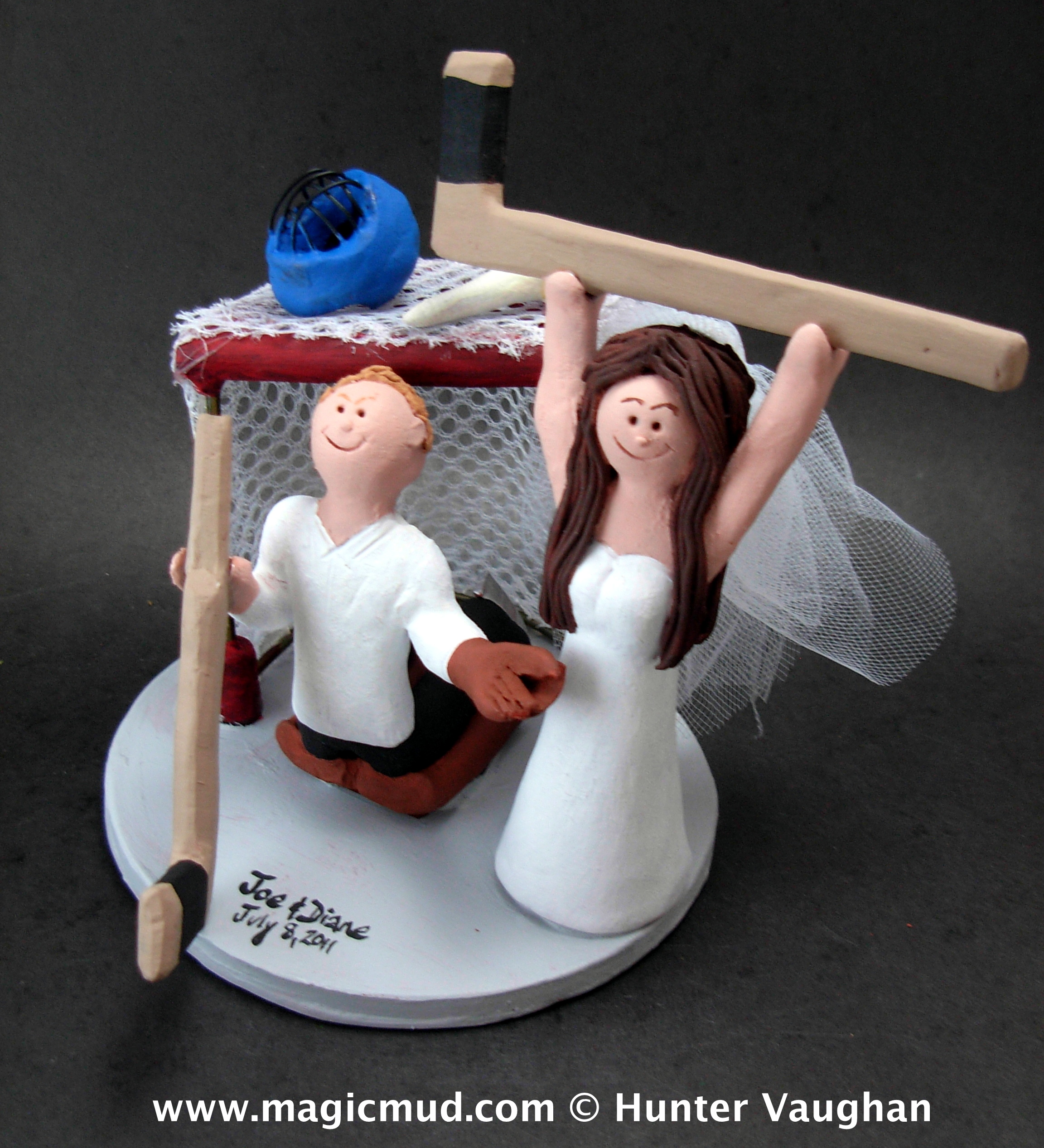 Hockey bride scores on goalie groom wedding cake topper