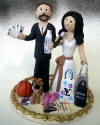 Customized Wedding Cake Topper for Poker Playing Groom and radio host Bride, with pet, shopping bags and on a base ringed by golden bows