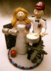 Jet Pilot with his drum and baseball hat, and bride with her weights and blackboard