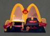 Custom Corporate Statue for McDonalds 25th Anniversary in Canada, the original restaurant next to the modern 