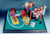 Clay figurine of Fruit King Joe Longo with his 3 sons hockey team, little daughter in arms and Wife chillin' in the pool. A Totally personalized present, made to your "specs"!