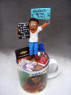 custom figurine...He's  on top of his coffee, with his personal items