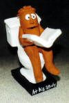  Clay Caricature of Man Reading on Toilet