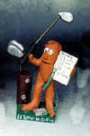 Clay Caricature of Him Golfing with his Schedule in hand