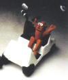 Clay Figurine of Man in golf cart