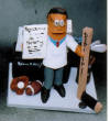 Custom Doctors Figurine with his hockey, football,golf,baseball and on his cel...what a busy M.D.