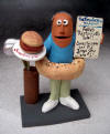 customized figurine for bagel restaurant owner, with his golf bag and special headline