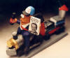 All aboard for a customized figurine... This train buff is straddling his own locomotive...a unique present like this can be made for the man in your life