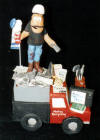 Custom figurine of recycling King on his "scrap" mobile