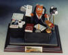 Trophy figurine of accountant with his camera, cafe, golf clubs and more...