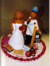 unique wedding cake topper made to order!! Baseball loving groom with his Bride who likes to bake!!
