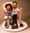 Custom made Cake Topper for a sports centered couple, she's in her soccer outfit with bridal veil and the giant diamond ring!!