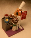 Custom figurine of the chef at her stove, a unique 50th Birthday gift
