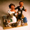 An Original Wedding Cake Topper, personal trainer Bride with Groom and their 3 pets 
